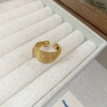 Detailed macro view of vintage golden mesh textured open ring on white display - Style 111 Gold (Woven Mesh Design)