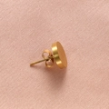 Detailed close-up of a single gold brushed titanium steel round stud earring on pink fabric - Gold Color Brushed Stud Earring / 1 Piece