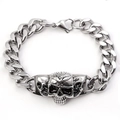 Detailed close-up of a silver punk skull charm on a polished Cuban link chain bracelet - Skull One (Stainless Steel/Lobster Clasp) / Silver