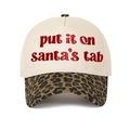 Detailed view of Put It On Santa's Tab embroidery on beige hat with leopard print brim - Cream/Leopard
