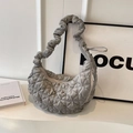 Neutral gray quilted crescent shoulder bag with ruched strap and puffy cloud-like texture - Gray