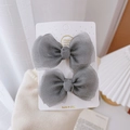 Pair of gray mesh bow hair clips for girls displayed on a white product card - Grey Gauze Bow Pair