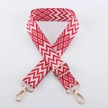 Detail of red and white geometric embroidery on adjustable strap with gold metal hooks - Light Gold Buckle / Red