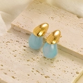 Modern gold teardrop earrings with light blue marble texture resin on travertine stone - Light Blue