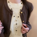 Vintage Y-shape gold necklace with elegant pearls and dark beads on model - Long Y-shaped Faux Pearl Necklace
