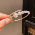 Close-up of luxury multi-layer pearl and rhinestone open bangle in rose gold finish - 19# Bracelet - Gold