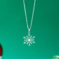 Detailed close-up of a silver snowflake pendant with a delicate O-chain link design - Snowflake Type B / Silver