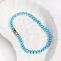 Detail of sky blue marquise zircon tennis bracelet set in silver metal on shell tray - Turquoise Green - Platinum