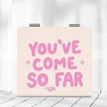 Macro view of pink faux leather foldable mirror with YOU'VE COME SO FAR quote detail - Pink-So Far