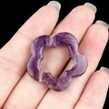 Handheld view of a 30mm hollow amethyst flower pendant with natural crystal textures - Amethyst