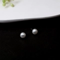 Classic round white pearl stud earrings with sterling silver needles on black background - E3145-White Round Single Pearl Studs