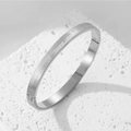 Minimalist silver titanium steel bangle with fovelove grid pattern on white stone - Steel