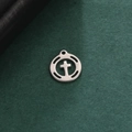 Macro shot of silver hollow circular pendant with a cross design on dark felt background - Round Hollow Cross / Silver