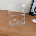Close-up of a four-tier clear acrylic earring organizer rack on a wooden surface - Organizer Rack-Transparent