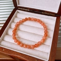 Elegant natural orange sunstone beaded bracelet displayed on a dark wooden jewelry box - 69# Pink Exquisite Gift Box (69# Bracelet - Pink - Exquisite Gift Box)