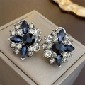 Close-up of vintage flower earrings with blue and white crystals on a jewelry box - 31# Silver Pin - Black Flower