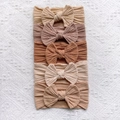 Close-up of five-piece set elastic ribbed knit baby headbands with large bows in earth tones - Earth Tones (Beige/Mocha/Brown/Coffee)