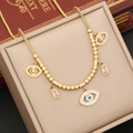 Gold evil eye necklace with turquoise square stones on snake chain in jewelry box - Evil Eye Necklace