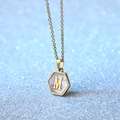 Gold titanium steel necklace featuring a hexagonal white shell pendant with the letter M - Letter M