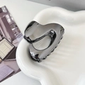 Minimalist dark gray metal hair claw clip with geometric U-shape design and glossy finish - Irregular Ball / Gunmetal