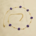 Golden stainless steel necklace featuring purple flower beads and adjustable lobster clasp - Blue Necklace