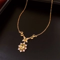 Close-up of gold-plated necklace with oval yellow crystal pendant and flower detail - 36# Gold Green Gemstone Necklace