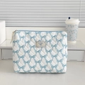 Detail of quilted white makeup bag with light blue bows and good night label - Clutch Bag / Blue