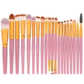 Macro shot of 20 professional makeup brushes with pink handles and golden metal tubes - Pink Handle + Gold Tube