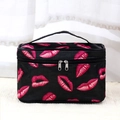 Black cosmetic bag with red lip pattern, double zipper, and handle for travel storage - Black Lip Print