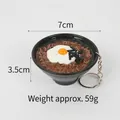 Miniature black bowl of Korean black bean noodles keychain with fried egg and seaweed - Poached Egg Soba Noodles Keychain