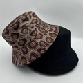 Detail view of leopard print and solid black bucket hats featuring high-quality fabric texture - Brown Leopard 2-Piece Set (13)