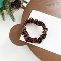 Dark brown satin scrunchie with pleated design on a natural wooden display tray - Small / Caramel color