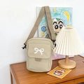 Khaki nylon crossbody bag featuring cute white bow embroidery and adjustable strap - Khaki