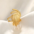 Macro shot of gold-plated hammered texture layered ring on white silk fabric folds - Irregular Lines / Gold