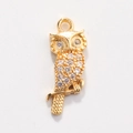 Macro view of gold owl pendant with white zircon inlay on a minimalist white background - Style 15-Rhinestone Owl