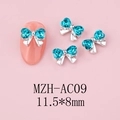 Detailed view of silver bow nail charms with heart-shaped blue rhinestones and sizing - Silver Base Blue (AC09)
