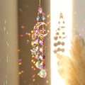 Detailed view of crystal suncatcher casting rainbow light reflections on a wall - Colorful Moon