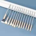 15-piece gray and rose gold makeup brush set with soft bristles on blue background - 13Pcs Blue Bridge Eye Brush Set