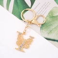 Detail view of a gold butterfly keychain with sparkling rhinestones and lobster clasp - Letter Y