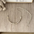 Macro detail of Bohemian woven cotton rope belt featuring natural seashell decorations - Small White Flower - 135cm