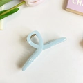 Sky blue glossy resin hair claw clip with a twisted cutout design on a white surface - 13cm / Sky Blue