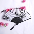 Ancient style folding fan with ink bird painting, black carved bamboo frame and tassel - White Ink Flower & Bird Style (Lady Fan-77)