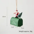 Christmas Santa figurine on green mailbox with a miniature tree hanging ornament - Green Santa Mailbox