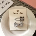 Sparkly silver cartoon cat and bow hair clip set on a minimalist white plate - Cat + Bow