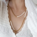 Close-up of double-layered pearl and gold pendant necklace worn on a lace knit outfit - 16# Necklace-Gold-Double Layer Long