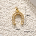 Macro view of gold horseshoe pendant with crystals measuring 15mm by 10mm and weighing 0.5g - Pave Zirconia Gold Horseshoe