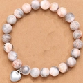 Pink Zebra Jasper stone bead bracelet with a silver heart charm on neutral background - Pink Zebra Heart Without Card