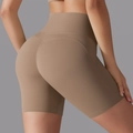 Detailed back view of high waist yoga shorts featuring lifting effect in camel color - Cocoa