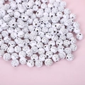 White acrylic round beads with silver rose pattern for DIY jewelry making on pink background - 8mm White Round Rose Beads Silver (100pcs)