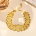 Bohemian gold coin bracelet with embossed circular pendants and heart charm clasp - Large Disc Coin Bracelet